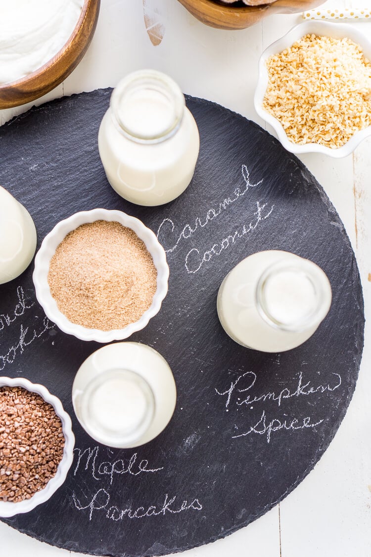 This Iced Coffee Bar is a must have at any get-together! Mix up the four homemade coffee creamer recipes so your guests can really indulge in their cup of joe!