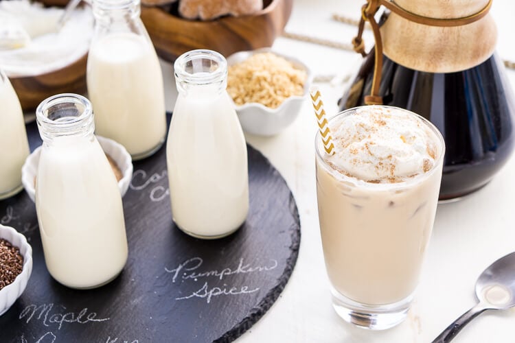 This Iced Coffee Bar is a must have at any get-together! Mix up the four homemade coffee creamer recipes so your guests can really indulge in their cup of joe!
