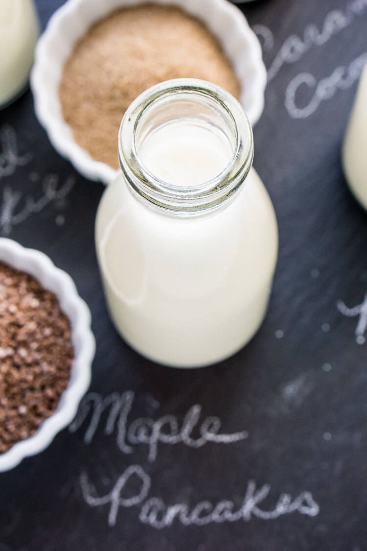 This Iced Coffee Bar is a must have at any get-together! Mix up the four homemade coffee creamer recipes so your guests can really indulge in their cup of joe!