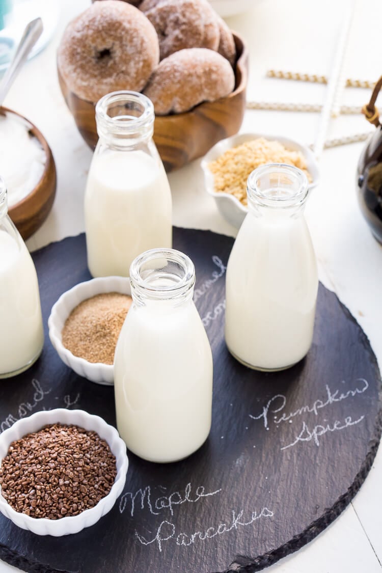 This Iced Coffee Bar is a must have at any get-together! Mix up the four homemade coffee creamer recipes so your guests can really indulge in their cup of joe!