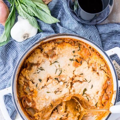 This Easy One Pot Lasagna is a cozy and comforting dish you can make in your dutch oven in under an hour. A delicious meat sauce, oven-ready pasta, and three different kinds of cheese with a hint of basil and red pepper flakes make this a dish you'll want to make again and again!