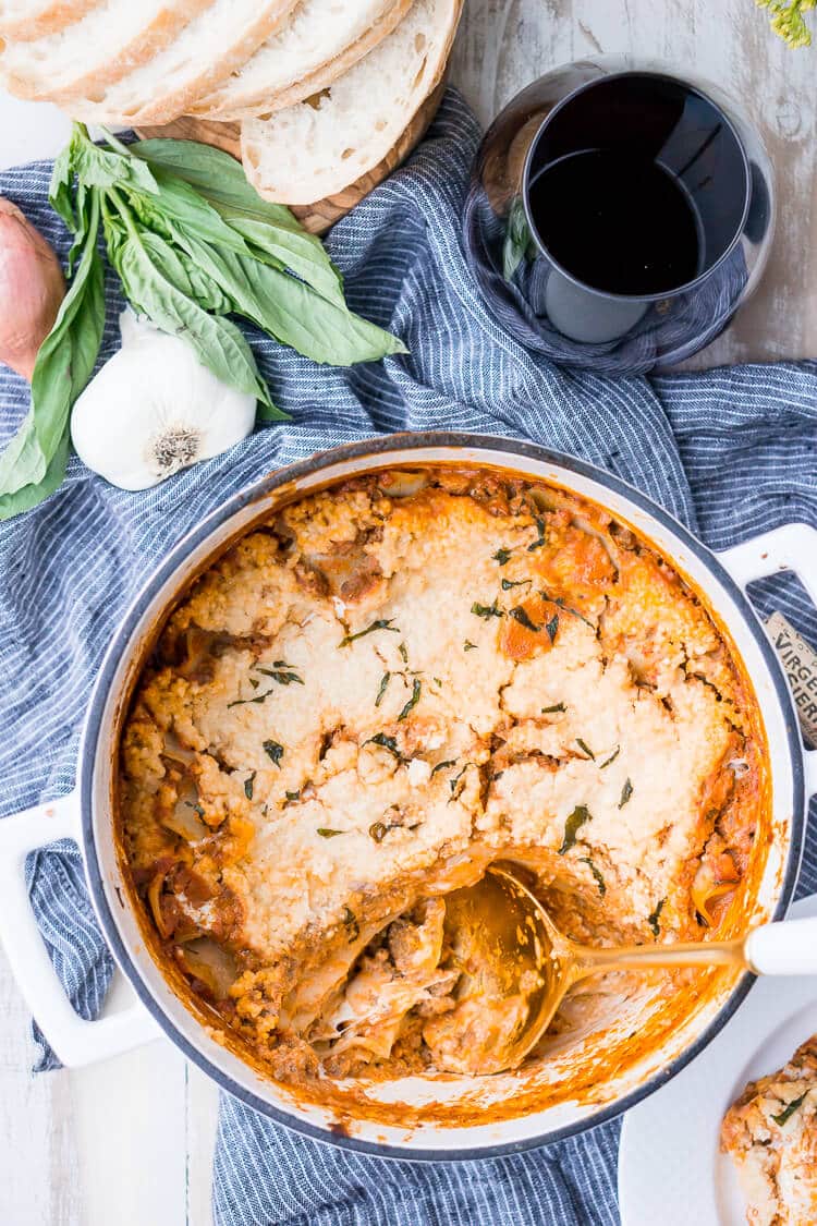 This Easy One Pot Lasagna is a cozy and comforting dish you can make in your dutch oven in under an hour. A delicious meat sauce, oven-ready pasta, and three different kinds of cheese with a hint of basil and red pepper flakes make this a dish you'll want to make again and again!