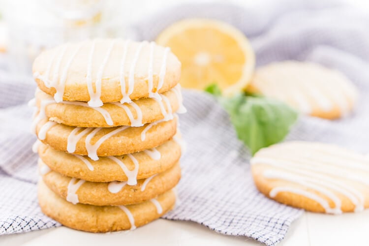 These Lemon Basil Shortbread Cookies will melt in your mouth, they're rich, sweet, and flaky. Made with butter, confectioners' sugar, flour, lemon zest, basil, and salt, they're perfect for tea, parties, or snacking!