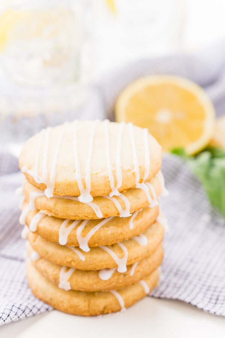 These Lemon Basil Shortbread Cookies will melt in your mouth, they're rich, sweet, and flaky. Made with butter, confectioners' sugar, flour, lemon zest, basil, and salt, they're perfect for tea, parties, or snacking!