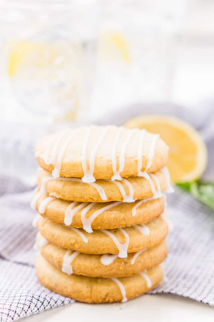 These Lemon Basil Shortbread Cookies will melt in your mouth, they're rich, sweet, and flaky. Made with butter, confectioners' sugar, flour, lemon zest, basil, and salt, they're perfect for tea, parties, or snacking!