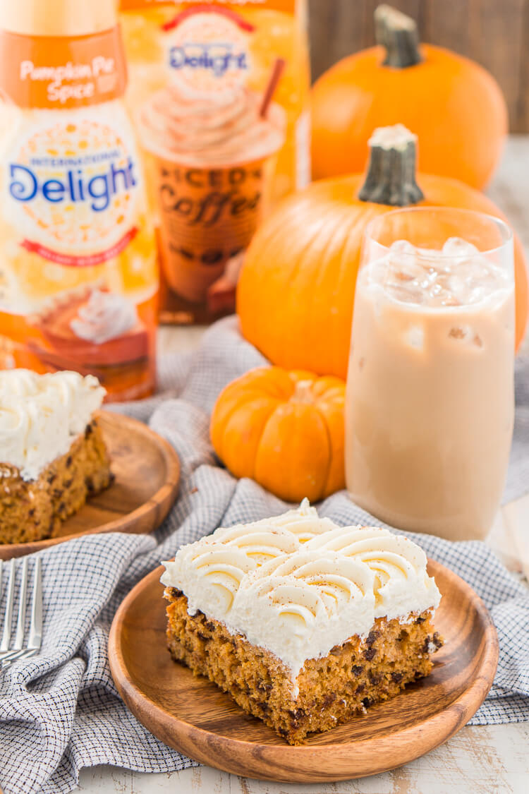 This Pumpkin Chocolate Chip Poke Cake is a deliciously seasonal dessert that's great for potlucks and family gatherings. A dense pumpkin spice cake soaked in sweetened condensed milk and loaded with chocolate chips is topped with a fluffy cheesecake frosting and dusted with cinnamon!