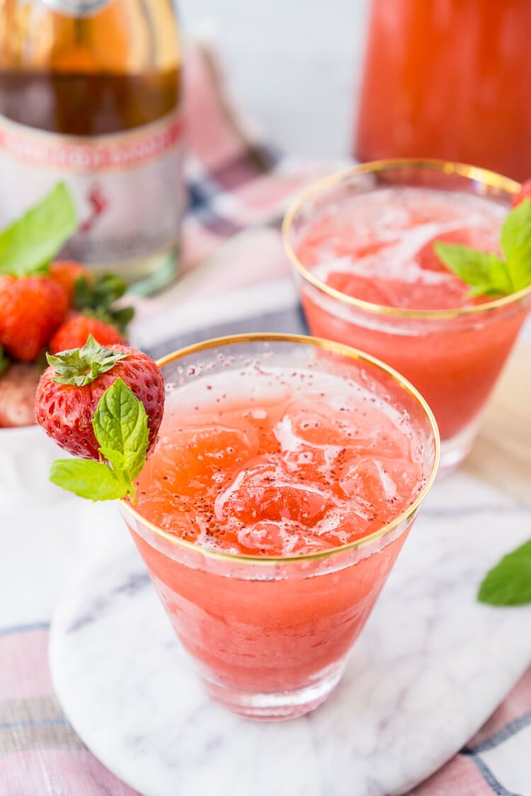 This Strawberry Champagne Punch is the ultimate pink drink! It's sparkly, easy to make, and loaded with strawberry sweetness! It's perfect for bridal showers, baby showers, and New Year's Eve Parties!