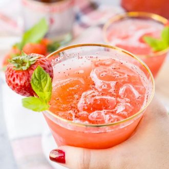 This Strawberry Champagne Punch is the ultimate pink drink! It's sparkly, easy to make, and loaded with strawberry sweetness! It's perfect for bridal showers, baby showers, and New Year's Eve Parties!