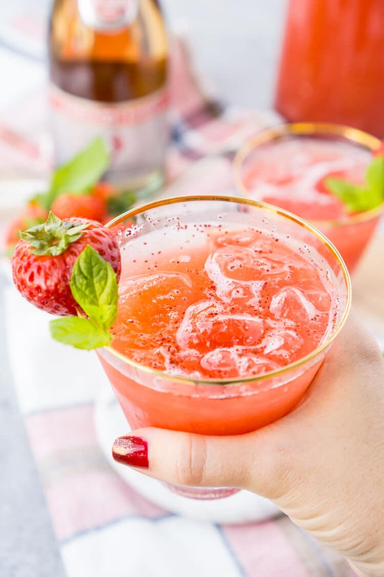 This Strawberry Champagne Punch is the ultimate pink drink! It's sparkly, easy to make, and loaded with strawberry sweetness! It's perfect for bridal showers, baby showers, and New Year's Eve Parties!