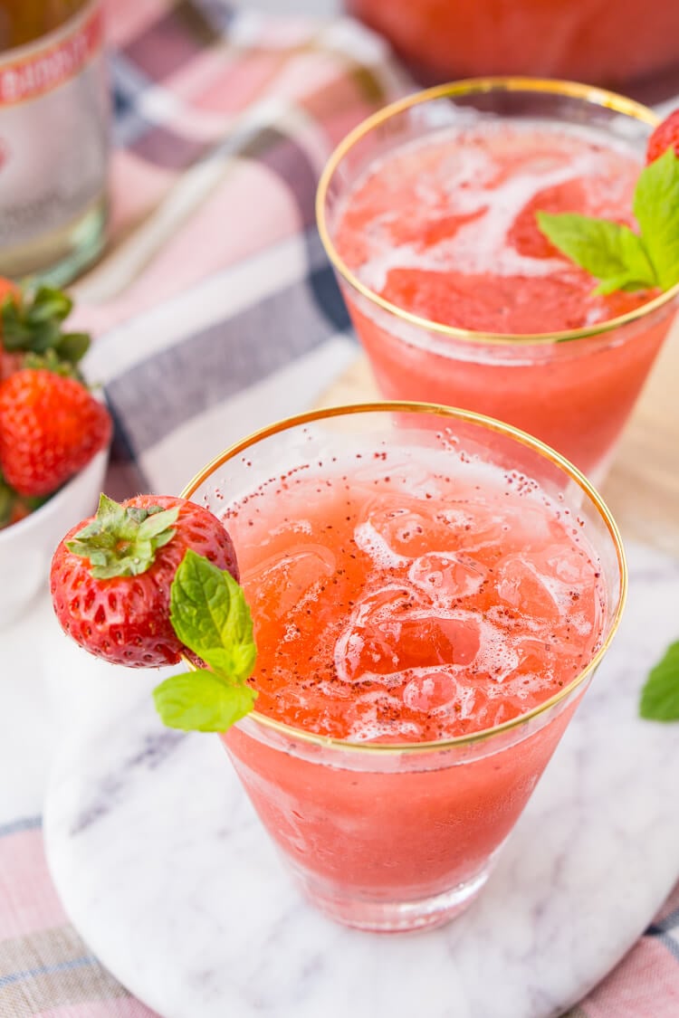 This Strawberry Champagne Punch is the ultimate pink drink! It's sparkly, easy to make, and loaded with strawberry sweetness! It's perfect for bridal showers, baby showers, and New Year's Eve Parties!