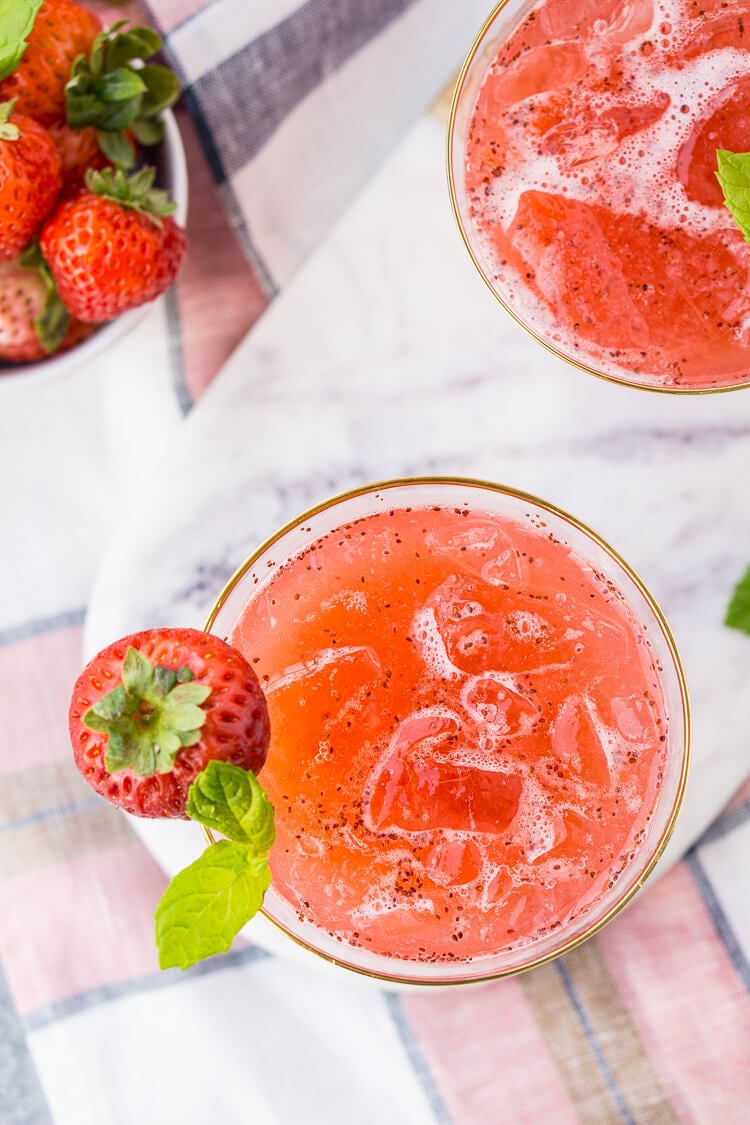 This Strawberry Champagne Punch is the ultimate pink drink! It's sparkly, easy to make, and loaded with strawberry sweetness! It's perfect for bridal showers, baby showers, and New Year's Eve Parties!