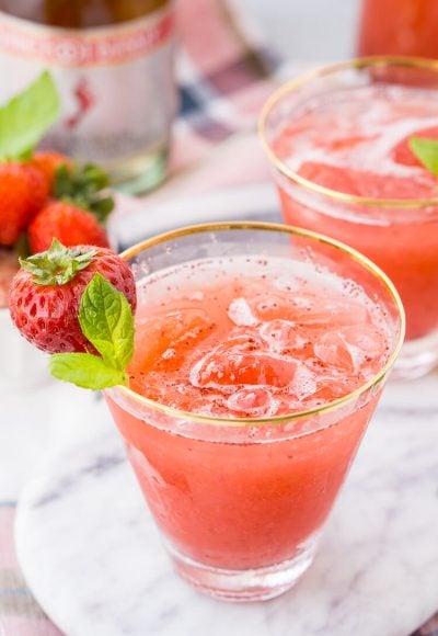 This Strawberry Champagne Punch is the ultimate pink drink! It's sparkly, easy to make, and loaded with strawberry sweetness!