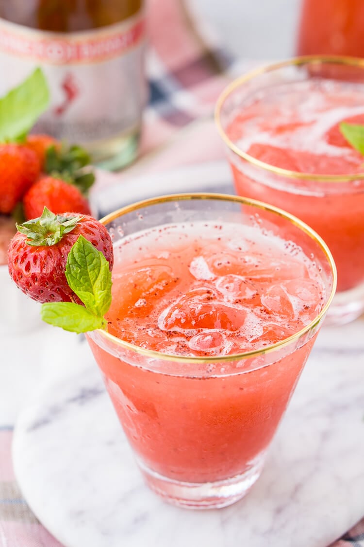 This Strawberry Champagne Punch is the ultimate pink drink! It's sparkly, easy to make, and loaded with strawberry sweetness! It's perfect for bridal showers, baby showers, and New Year's Eve Parties!