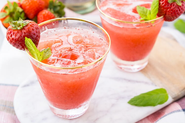 This Strawberry Champagne Punch is the ultimate pink drink! It's sparkly, easy to make, and loaded with strawberry sweetness! It's perfect for bridal showers, baby showers, and New Year's Eve Parties!