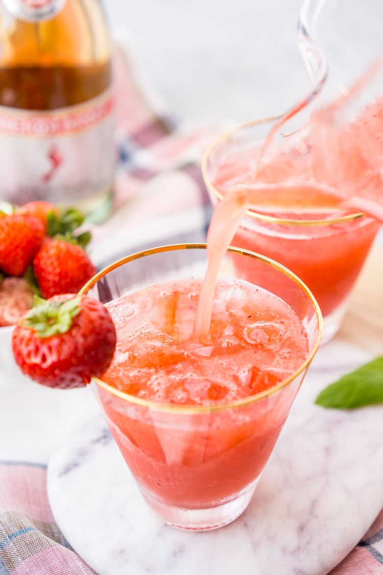 This Strawberry Champagne Punch is the ultimate pink drink! It's sparkly, easy to make, and loaded with strawberry sweetness! It's perfect for bridal showers, baby showers, and New Year's Eve Parties!