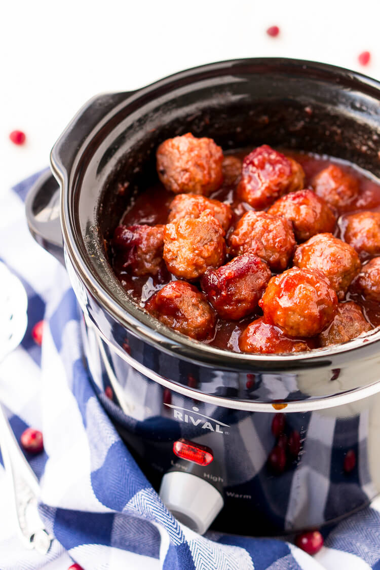 These Cranberry Orange Meatballs are made with just 4 ingredients with just 5 minutes of prep work! Let your crockpot take care of the rest and serve up this delicious appetizer at your holiday and game day parties!