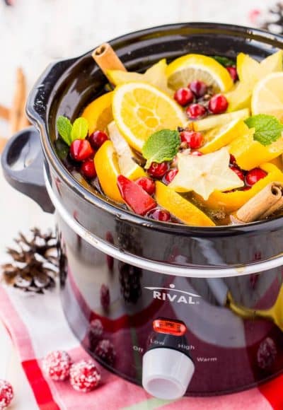 This DIY Holiday Crock Pot Potpourri will have your house smelling amazing all season long with sweet and spicy aromas of cranberries, oranges, mint, cloves, cinnamon, and more!