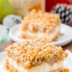 Close up photo of a pear cheesecake bar on a white plate.