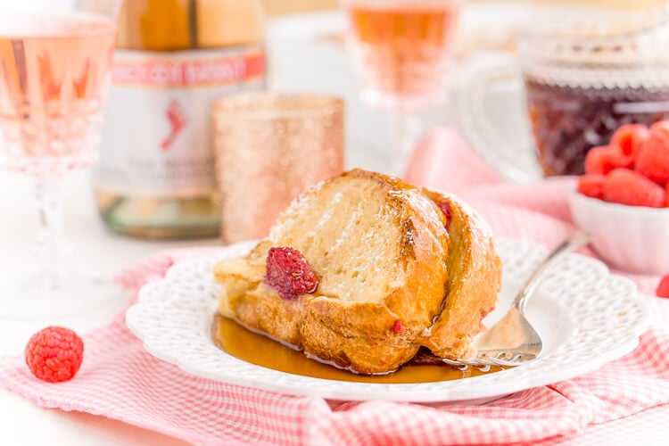 Champagne Raspberry Baked French Toast is the perfect way to kick off the New Year, Valentine's Day, or an anniversary! Prep it the night before so all you have to do is bake it in the morning!