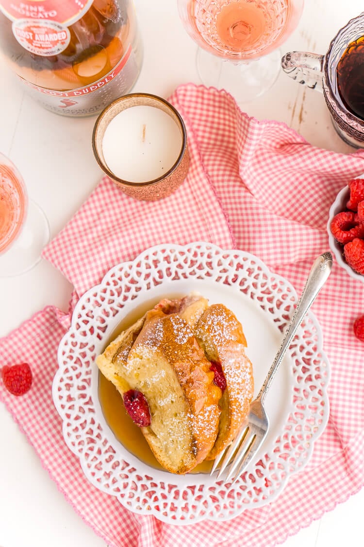 Champagne Raspberry Baked French Toast is the perfect way to kick off the New Year, Valentine's Day, or an anniversary! Prep it the night before so all you have to do is bake it in the morning!