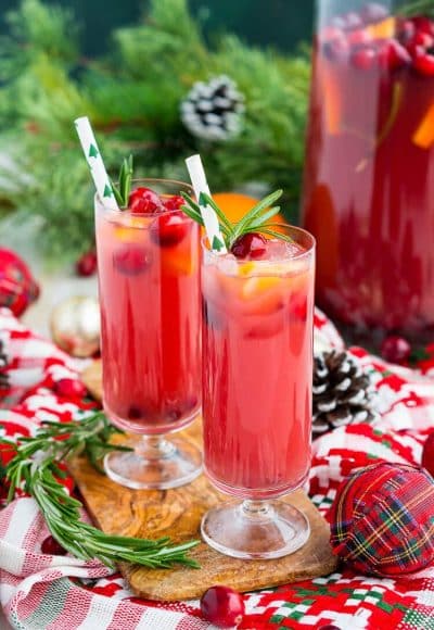 Christmas Punch is an easy and delicious holiday party drink packed with fruits like cranberries, oranges, and pomegranates. Keep it non-alcoholic or add rum or vodka for extra holiday spirit!