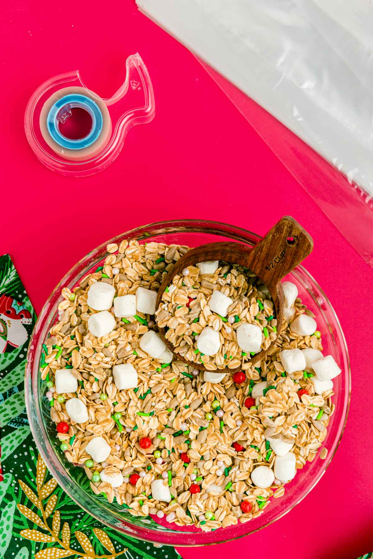 Magic reindeer food mixed together in a large bowl on a red surface.