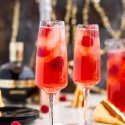New Year's Eve Champagne Punch is loaded with Triple Sec, blackberry brandy, Chambord, pineapple juice, ginger ale, and champagne for a drink that's sure to impress all your NYE party guests!