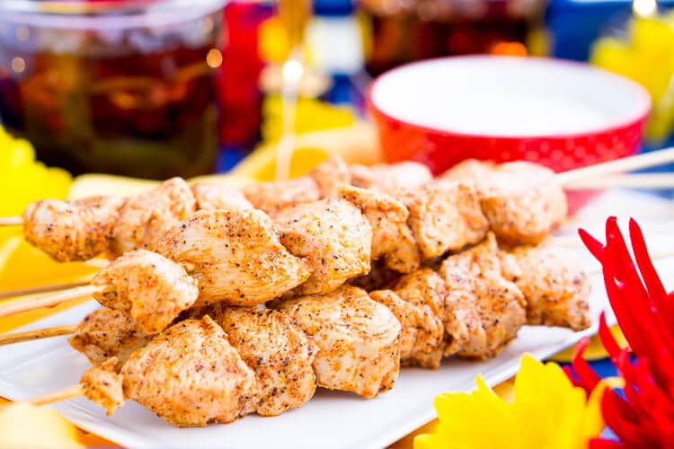 These Baked Cajun Chicken Skewers are marinated in zesty Cajun flavors, baked to perfection, and served with a creamy and cool mint yogurt sauce.