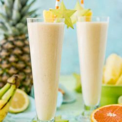 Tropical Smoothie is a delicious way to get in some vitamin C, protein, and potassium for breakfast or as an afternoon snack! It's loaded with orange juice, lime juice, lemon juice, banana, pineapple, and coconut extract for an extra fruity tropical flavor!