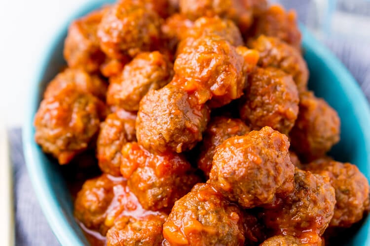 Pineapple Tequila Meatballs will get your game day party started out right! Just dump the four ingredients in the crock pot and let them slow cook for about 2 hours and they're ready to go!