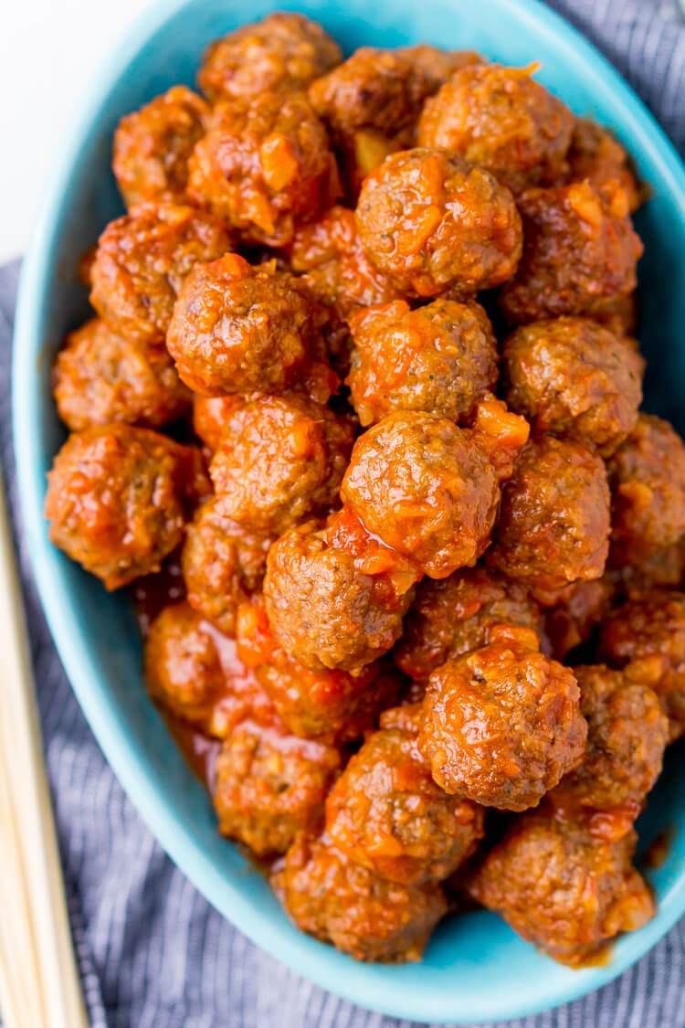 Pineapple Tequila Meatballs will get your game day party started out right! Just dump the four ingredients in the crock pot and let them slow cook for about 2 hours and they're ready to go!