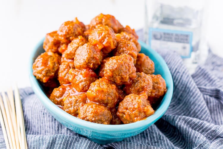 Pineapple Tequila Meatballs will get your game day party started out right! Just dump the four ingredients in the crock pot and let them slow cook for about 2 hours and they're ready to go!