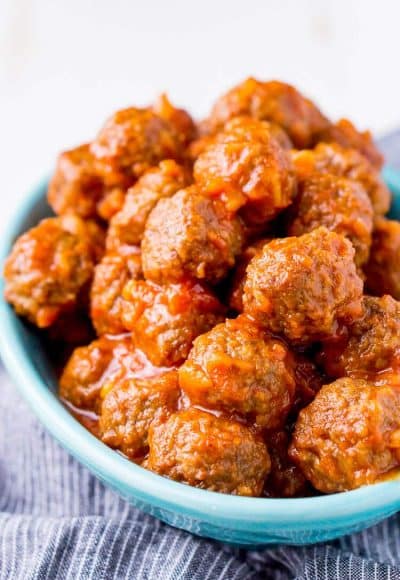 Pineapple Tequila Meatballs will get your game day party started out right! Just dump the four ingredients in the crock pot and let them slow cook for about 2 hours and they're ready to go!