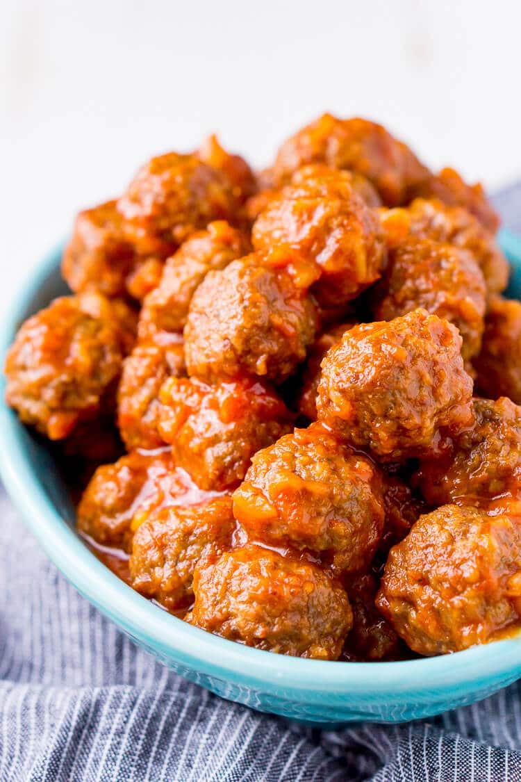 Pineapple Tequila Meatballs will get your game day party started out right! Just dump the four ingredients in the crock pot and let them slow cook for about 2 hours and they're ready to go!