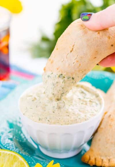 This Spicy Cilantro Lime Aioli is the perfect pairing for chicken empanadas, tortilla chips, and so much more. A blend of cilantro, jalapeños, lime, garlic, and spices make for an addictive dip!