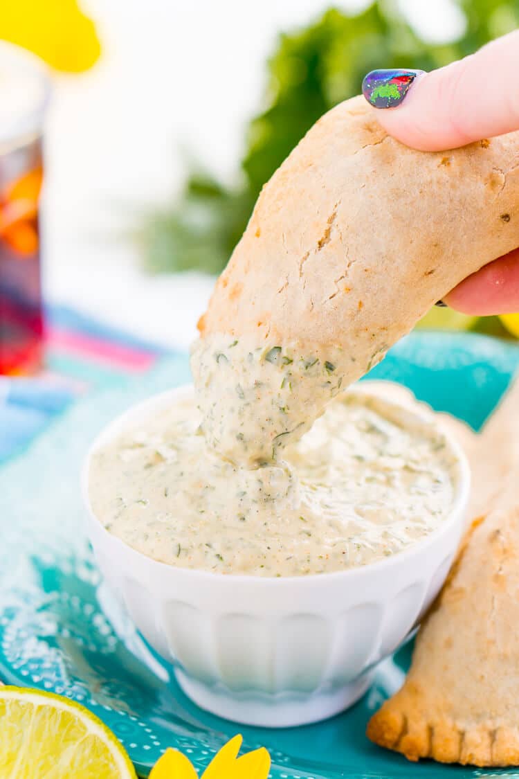 This Spicy Cilantro Lime Aioli is the perfect pairing for chicken empanadas, tortilla chips, and so much more. A blend of cilantro, jalapeños, lime, garlic, and spices make for an addictive dip!