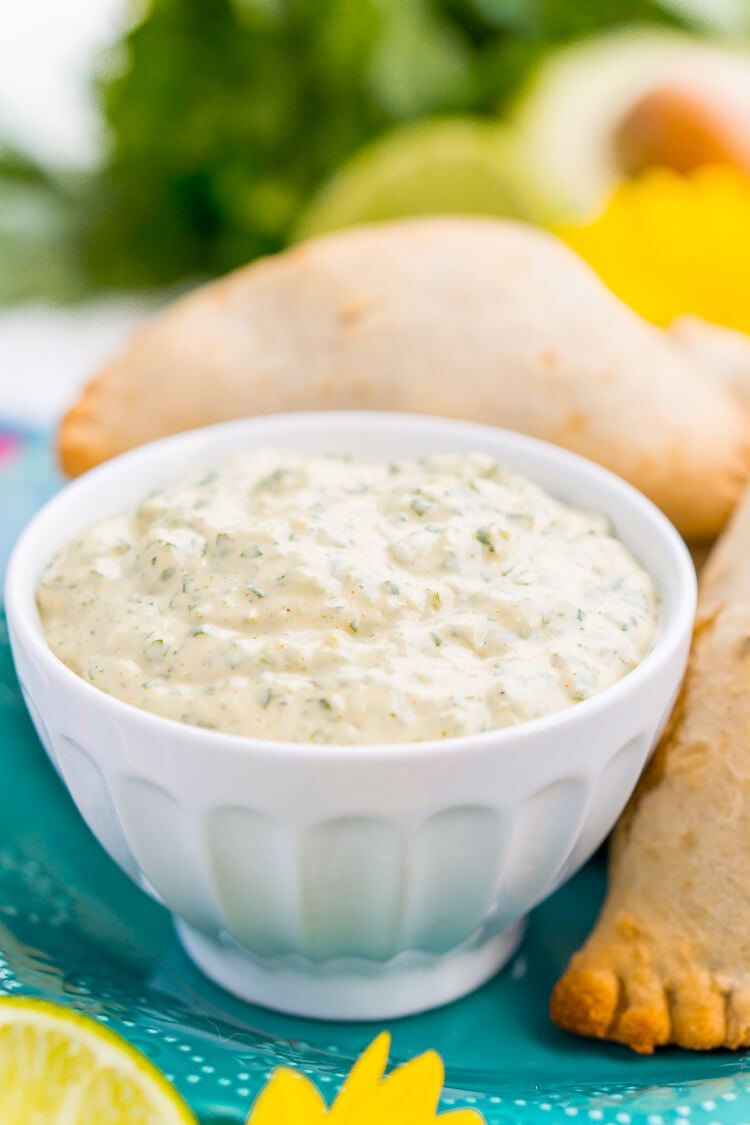 This Spicy Cilantro Lime Aioli is the perfect pairing for chicken empanadas, tortilla chips, and so much more. A blend of cilantro, jalapeños, lime, garlic, and spices make for an addictive dip!