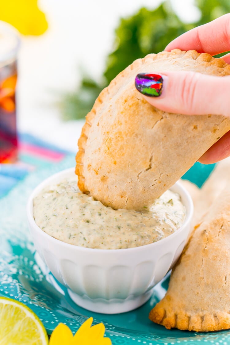 This Spicy Cilantro Lime Aioli is the perfect pairing for chicken empanadas, tortilla chips, and so much more. A blend of cilantro, jalapeños, lime, garlic, and spices make for an addictive dip!