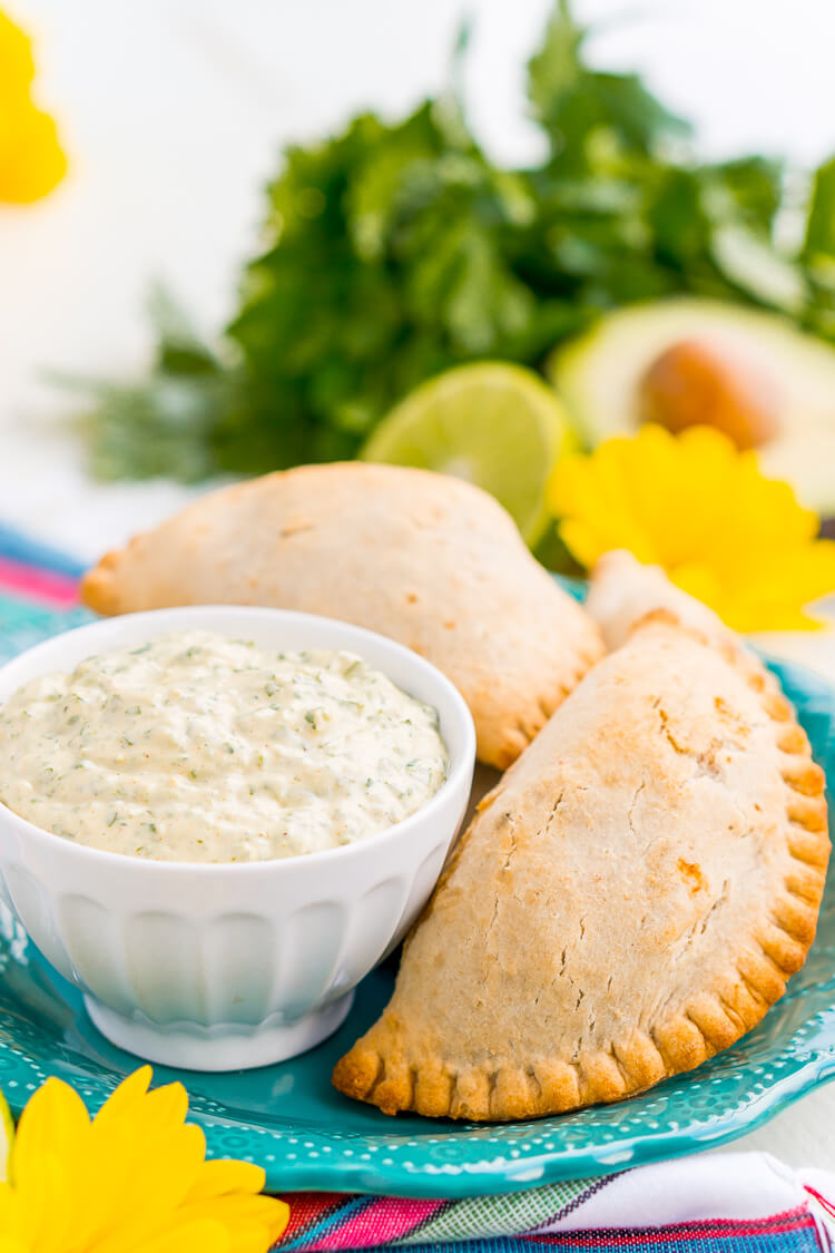 This Spicy Cilantro Lime Aioli is the perfect pairing for chicken empanadas, tortilla chips, and so much more. A blend of cilantro, jalapeños, lime, garlic, and spices make for an addictive dip!