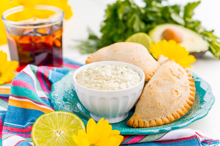 This Spicy Cilantro Lime Aioli is the perfect pairing for chicken empanadas, tortilla chips, and so much more. A blend of cilantro, jalapeños, lime, garlic, and spices make for an addictive dip!