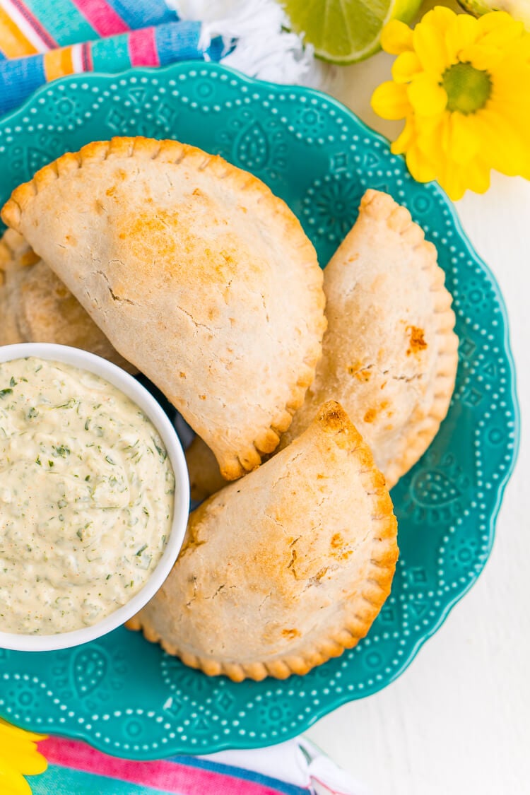 This Spicy Cilantro Lime Aioli is the perfect pairing for chicken empanadas, tortilla chips, and so much more. A blend of cilantro, jalapeños, lime, garlic, and spices make for an addictive dip!