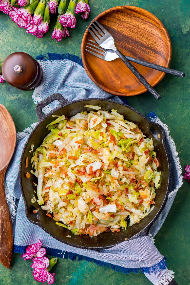 Irish Fried Cabbage and Bacon is a simple recipe that's pan fried in bacon grease and loaded up with bacon pieces and onion and seasoned with brown sugar, salt, and pepper.