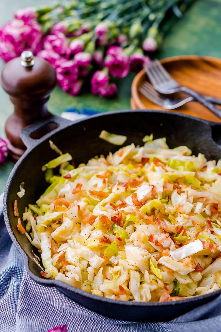 A cast iron skillet with fried cabbage.