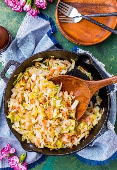 Irish Fried Cabbage and Bacon is a simple recipe that's pan fried in bacon grease and loaded up with bacon pieces and onion and seasoned with brown sugar, salt, and pepper.