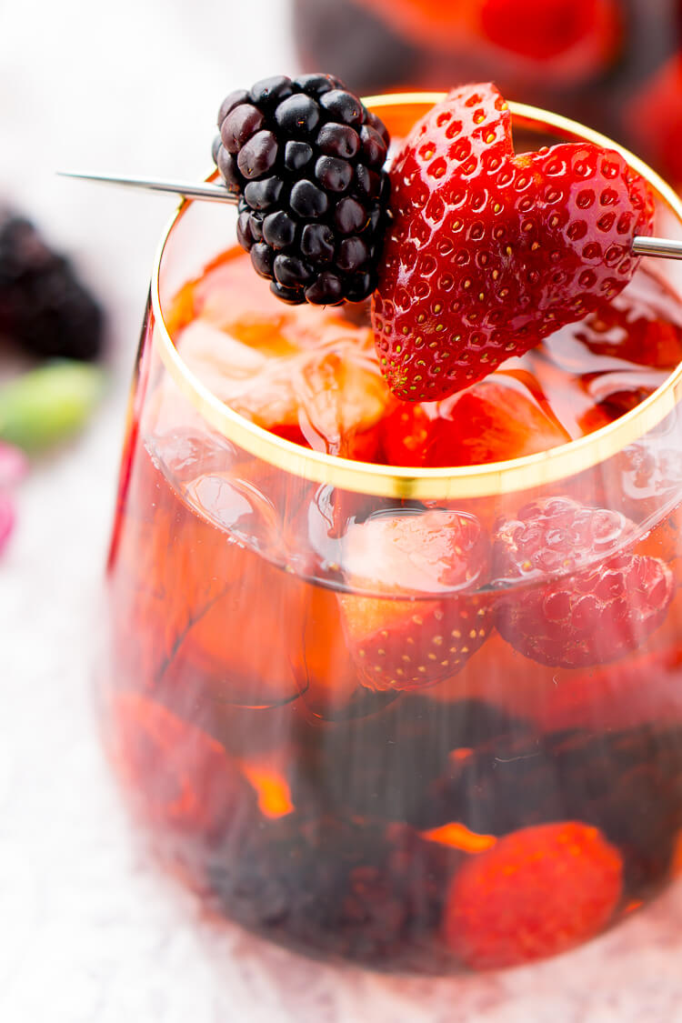 Rosé Berry Sangria is the perfect batch cocktail for Valentine's Day, Bridal Showers, and more! Made with rosé wine, Chambord, blackberry brandy, lemon-lime soda, and fresh berries!