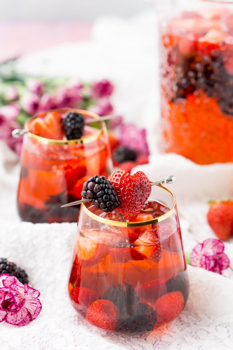 Rosé Berry Sangria is the perfect batch cocktail for Valentine's Day, Bridal Showers, and more! Made with rosé wine, Chambord, blackberry brandy, lemon-lime soda, and fresh berries!