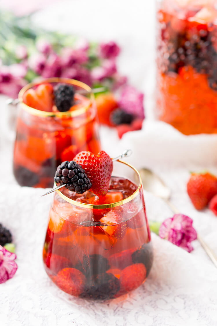 Rosé Berry Sangria is the perfect batch cocktail for Valentine's Day, Bridal Showers, and more! Made with rosé wine, Chambord, blackberry brandy, lemon-lime soda, and fresh berries!