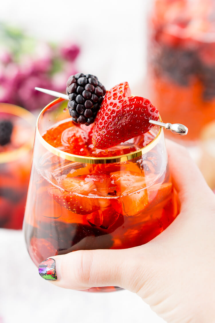 Rosé Berry Sangria is the perfect batch cocktail for Valentine's Day, Bridal Showers, and more! Made with rosé wine, Chambord, blackberry brandy, lemon-lime soda, and fresh berries!