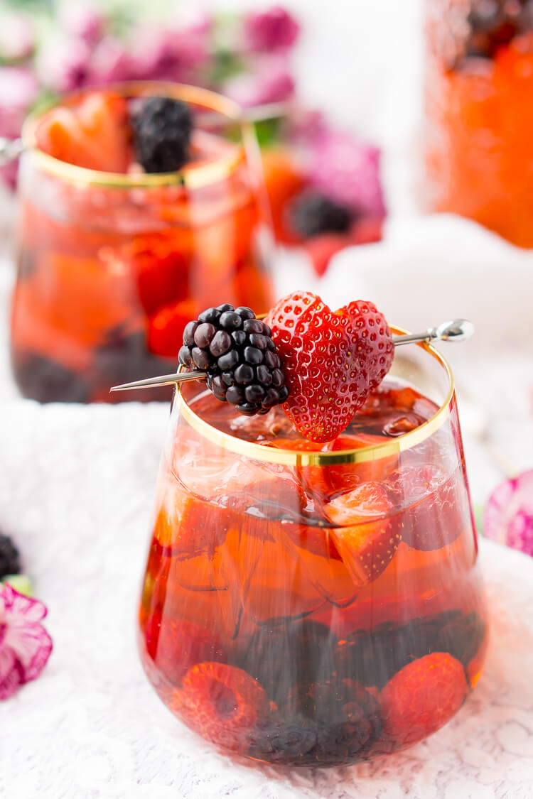 Rosé Berry Sangria is the perfect batch cocktail for Valentine's Day, Bridal Showers, and more! Made with rosé wine, Chambord, blackberry brandy, lemon-lime soda, and fresh berries!