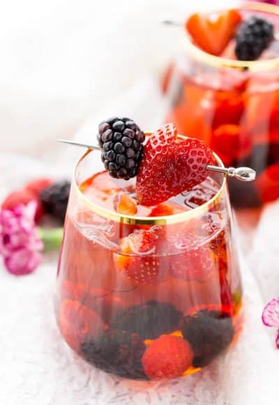 Rosé Berry Sangria is the perfect batch cocktail for Valentine's Day, Bridal Showers, and more! Made with rosé wine, Chambord, blackberry brandy, lemon-lime soda, and fresh berries!